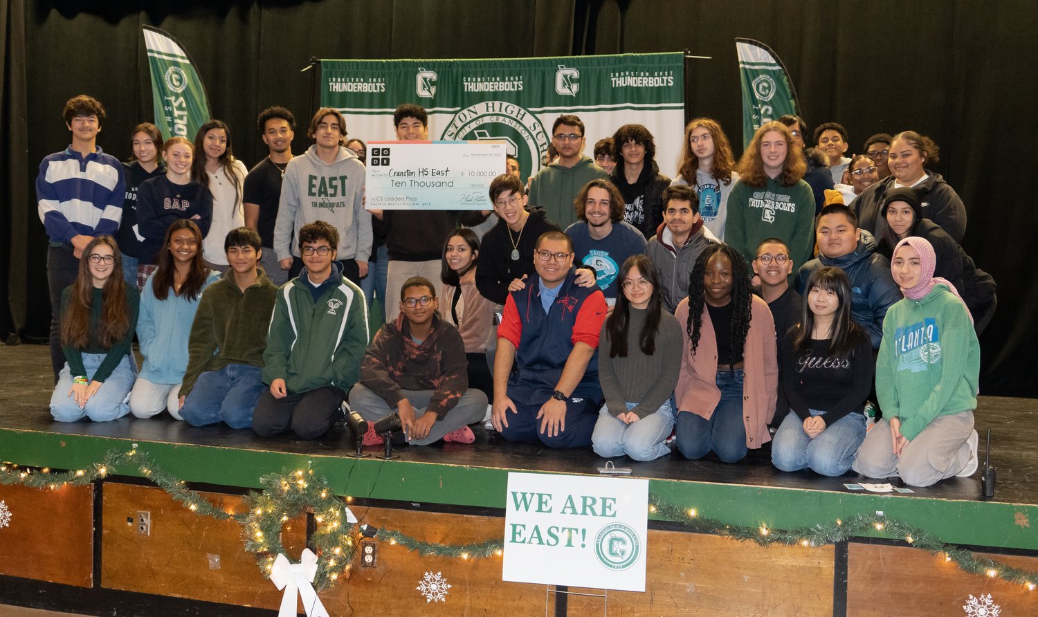 FURTHERING COMPUTER SCIENCE EDUCATION: Cranston High School East CTE students pose with a check presented to the school by Code.org on Dec. 14 to help further computer science education for underrepresented students. Rising Cranston East ninth graders will have the opportunity to enroll in Computer Science at Cranston East starting in the fall.